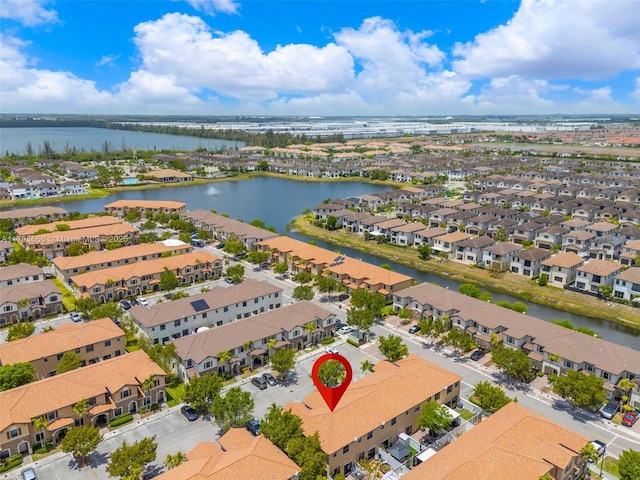 aerial view featuring a water view and a residential view