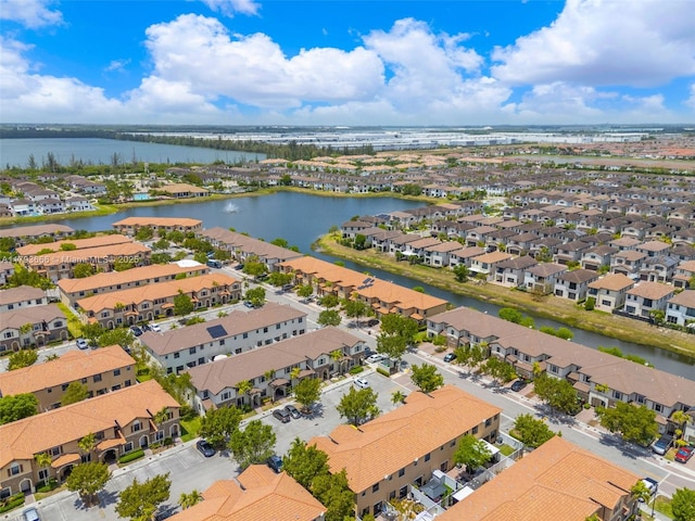 bird's eye view featuring a water view and a residential view
