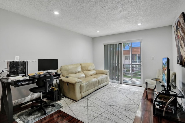 office space featuring recessed lighting, a textured ceiling, and wood finished floors