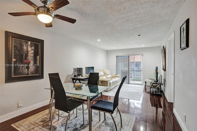 dining area featuring wood finished floors, baseboards, ceiling fan, recessed lighting, and a textured ceiling