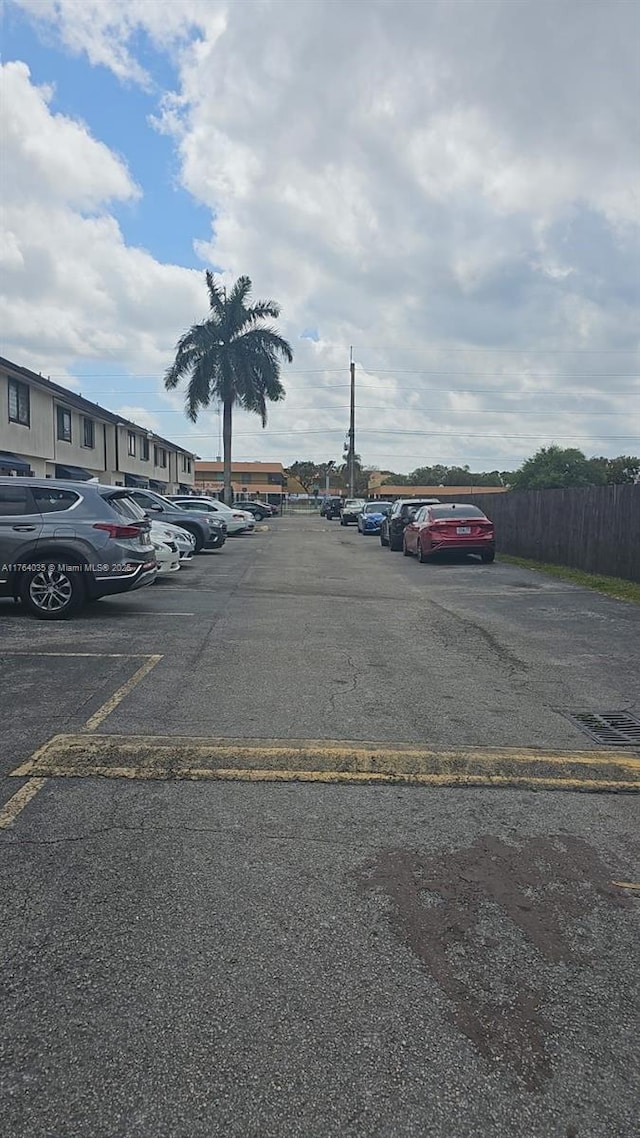 uncovered parking lot with fence