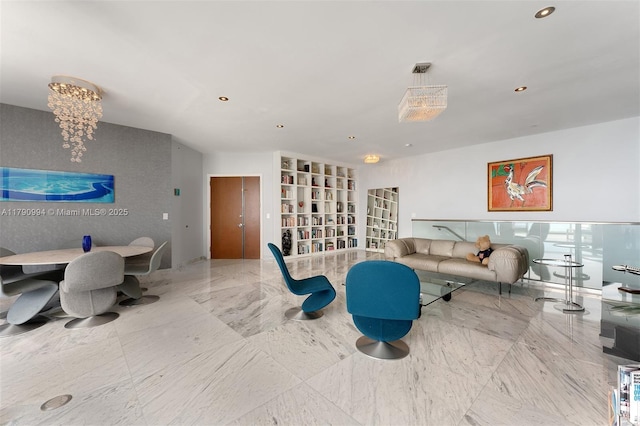 living area with recessed lighting and marble finish floor