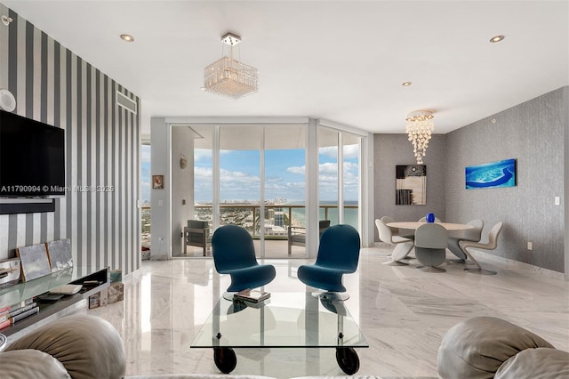 living room featuring expansive windows, recessed lighting, marble finish floor, and wallpapered walls