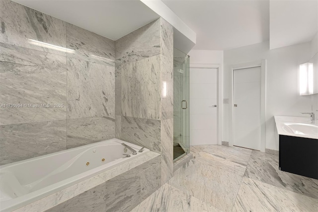 full bath with vanity, a whirlpool tub, and a shower stall