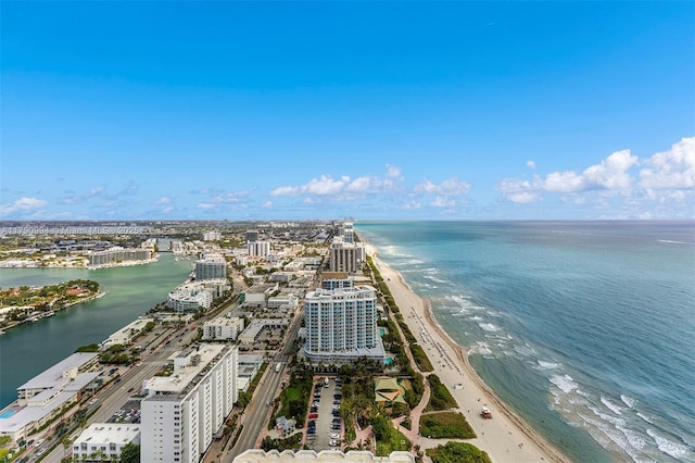 birds eye view of property with a water view and a view of city