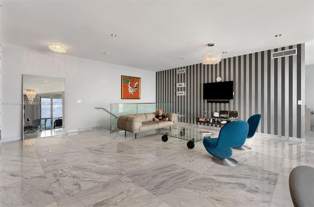 living area with an accent wall, wallpapered walls, baseboards, and marble finish floor