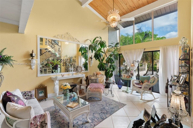 tiled living room with a ceiling fan, wood ceiling, high vaulted ceiling, and beamed ceiling