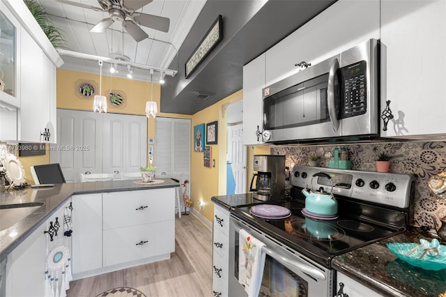 kitchen with white cabinets, a ceiling fan, stainless steel appliances, and visible vents