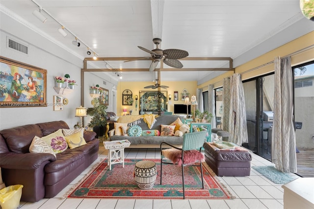 living room with a wealth of natural light, rail lighting, ceiling fan, and visible vents