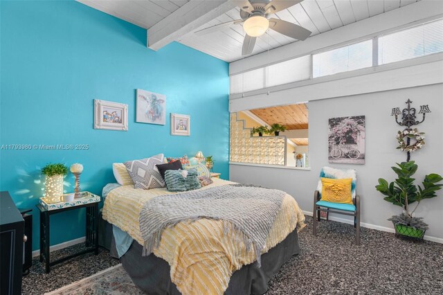 carpeted bedroom featuring baseboards, beamed ceiling, multiple windows, and wood ceiling