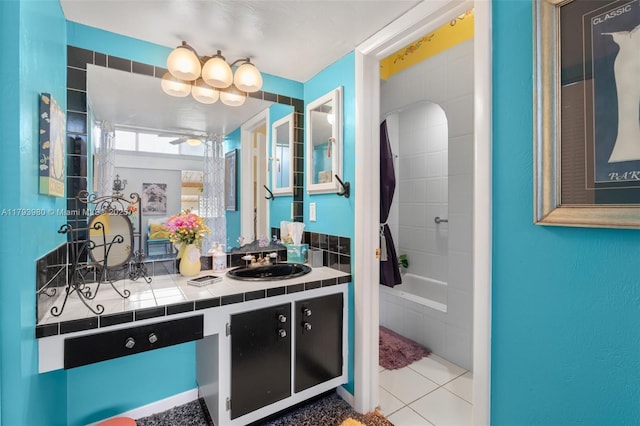 bathroom featuring vanity, washtub / shower combination, and tile patterned floors