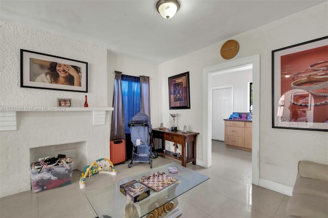 tiled living area with baseboards