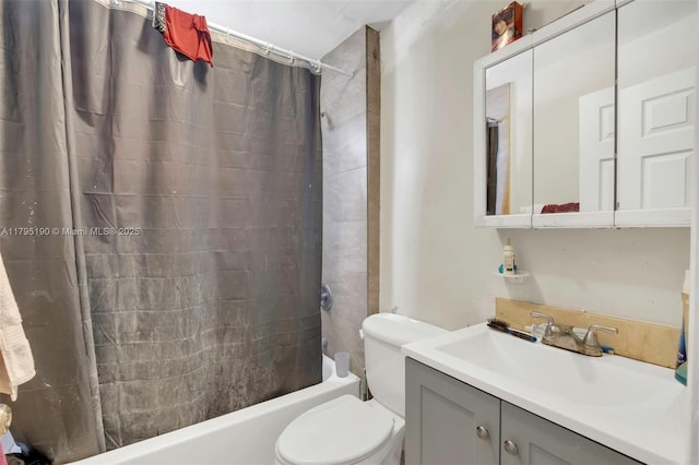 full bath featuring vanity, toilet, and shower / tub combo