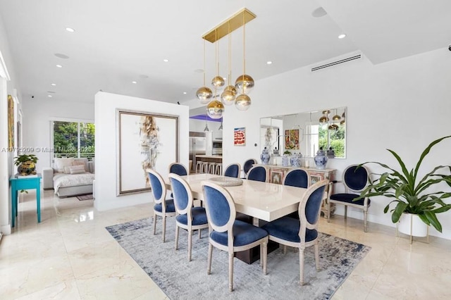 dining space with recessed lighting, a chandelier, and marble finish floor