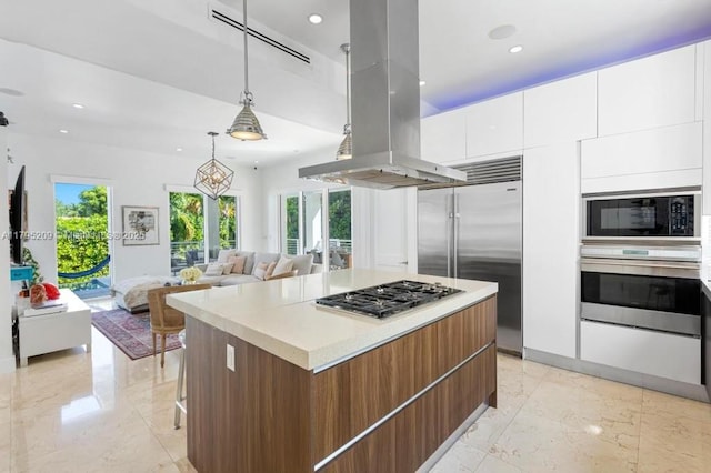 kitchen with plenty of natural light, built in appliances, and modern cabinets