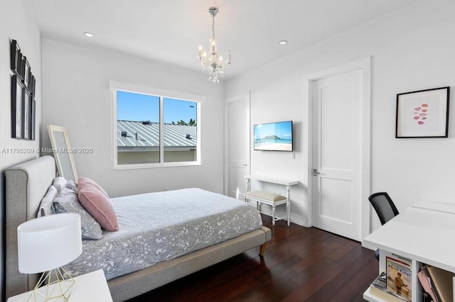 bedroom with recessed lighting, baseboards, dark wood finished floors, and a notable chandelier