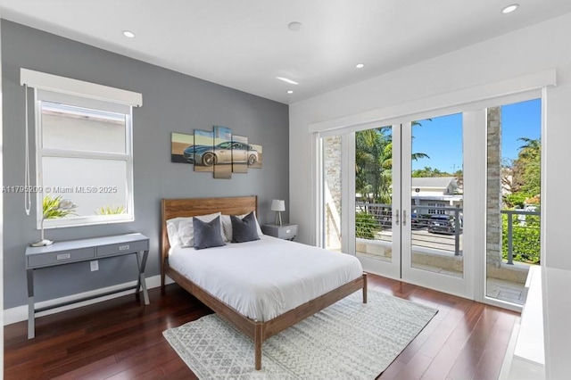 bedroom featuring wood-type flooring, recessed lighting, and access to exterior