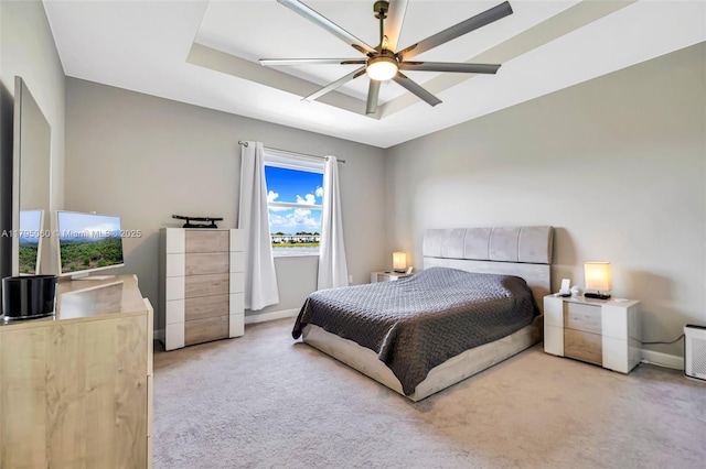 bedroom with baseboards, ceiling fan, and light colored carpet