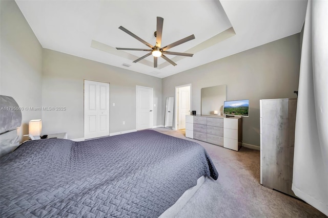 bedroom featuring a ceiling fan, baseboards, light colored carpet, and visible vents
