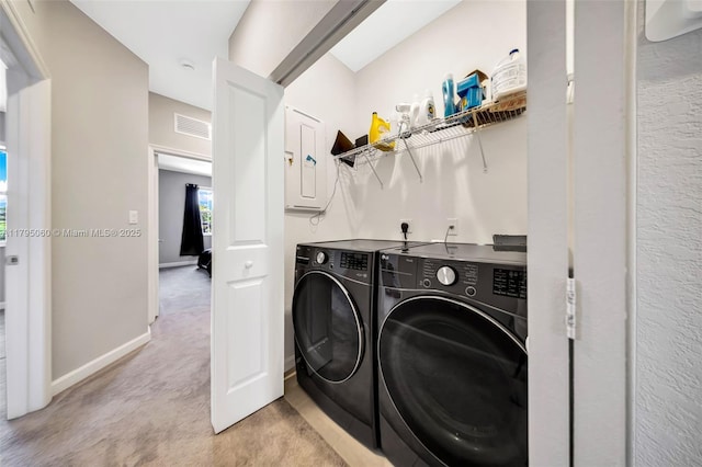 washroom with laundry area, light carpet, baseboards, visible vents, and washing machine and dryer