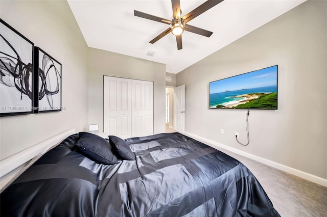 carpeted bedroom with baseboards, visible vents, ceiling fan, and a closet