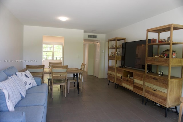 living room featuring visible vents