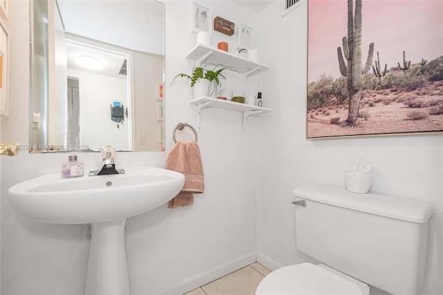 bathroom with tile patterned floors, baseboards, toilet, and visible vents