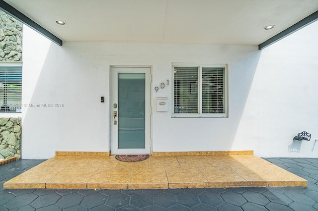 901 NW 22nd Pl, Miami, FL 33125 - doorway to property with stucco siding