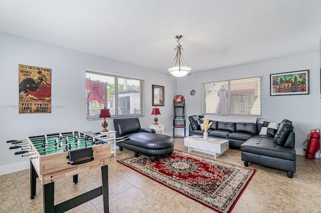 901 NW 22nd Pl, Miami, FL 33125 - interior space featuring baseboards, a textured ceiling, and light tile patterned floors