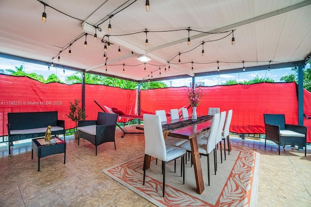 901 NW 22nd Pl, Miami, FL 33125 - view of patio / terrace with an outdoor living space, a fenced backyard, and outdoor dining space