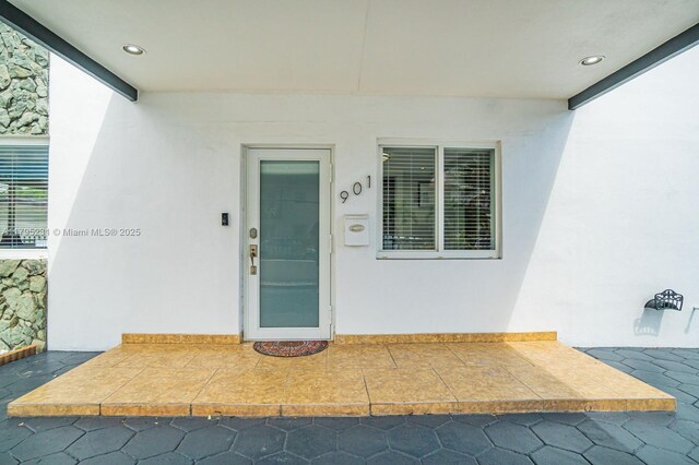 901 NW 22nd Pl, Miami, FL 33125 - doorway to property with stucco siding