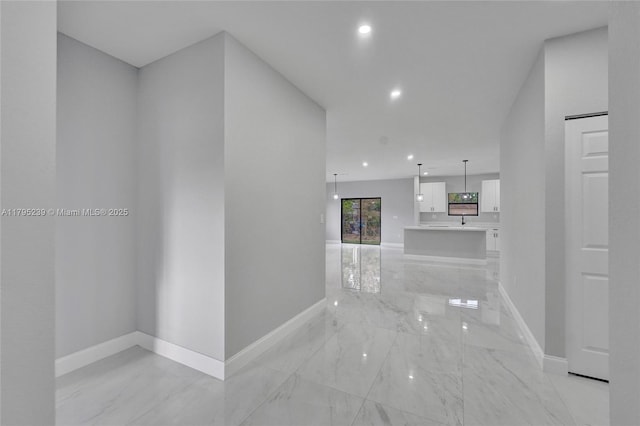 7806 NW 68th Ave, Tamarac, FL 33321 - hallway featuring baseboards, recessed lighting, and marble finish floor