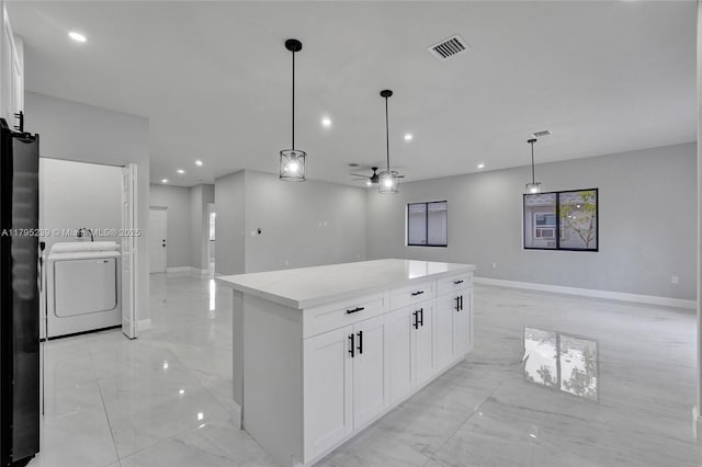 7806 NW 68th Ave, Tamarac, FL 33321 - kitchen with washer / clothes dryer, visible vents, freestanding refrigerator, marble finish floor, and open floor plan
