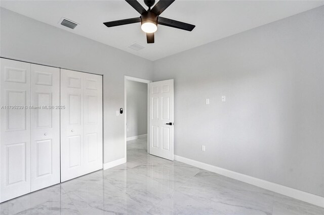 7806 NW 68th Ave, Tamarac, FL 33321 - unfurnished bedroom with visible vents, a closet, marble finish floor, baseboards, and ceiling fan