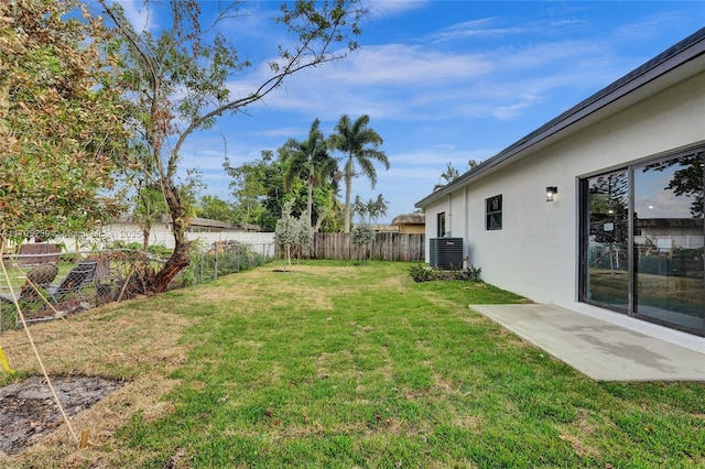 7806 NW 68th Ave, Tamarac, FL 33321 - view of yard with a fenced backyard, a patio, and central AC