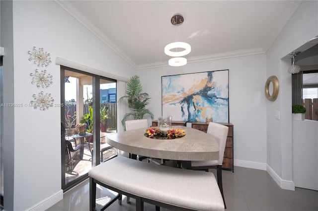 tiled dining room featuring crown molding, baseboards, and a healthy amount of sunlight