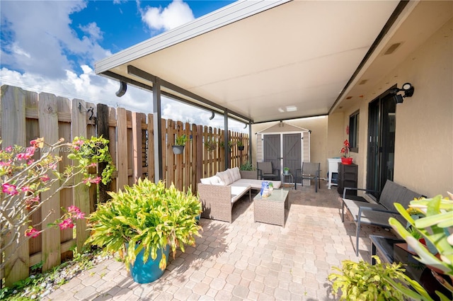 view of patio / terrace with fence and an outdoor living space