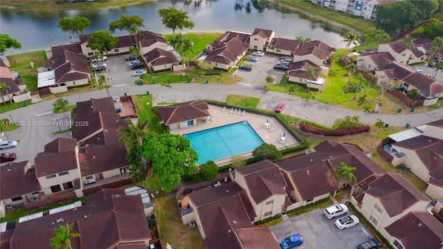 bird's eye view featuring a water view and a residential view