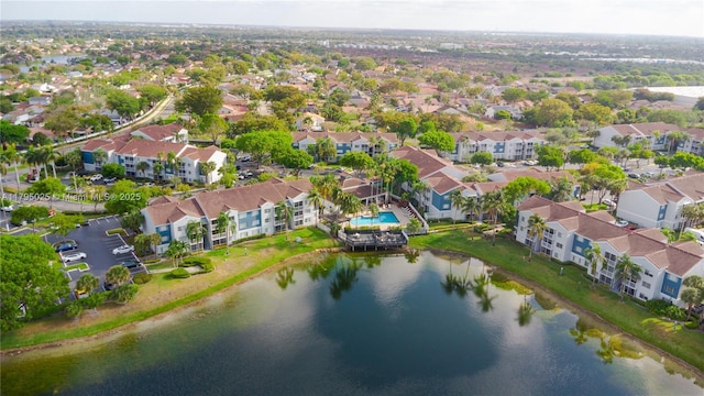bird's eye view with a water view and a residential view
