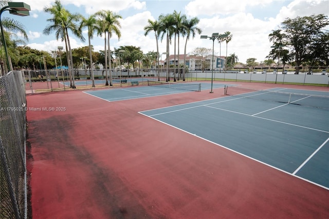 view of sport court featuring community basketball court and fence