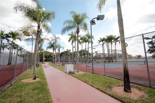 view of tennis court with fence