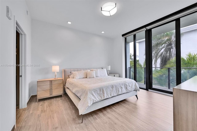 3581 E Glencoe St Unit 207, Miami, FL 33133 - bedroom with recessed lighting, light wood-style flooring, floor to ceiling windows, and multiple windows