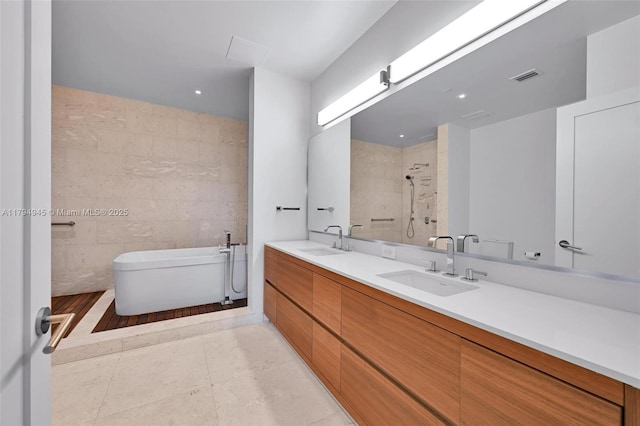 3581 E Glencoe St Unit 207, Miami, FL 33133 - bathroom featuring a sink, toilet, a bidet, and visible vents