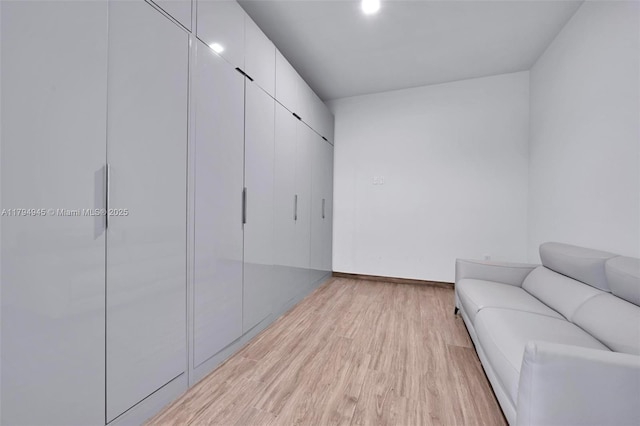 sitting room featuring light wood-style floors and baseboards