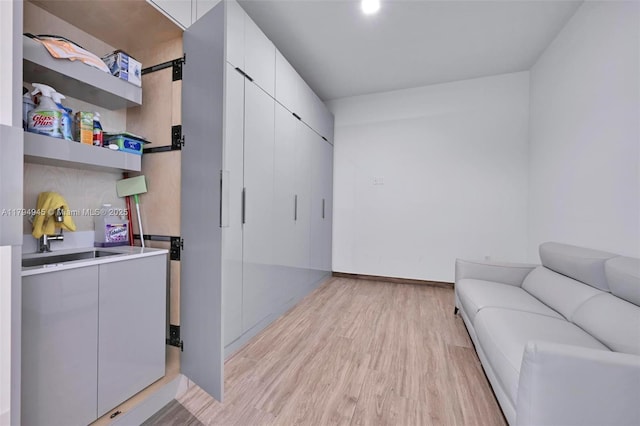 3581 E Glencoe St Unit 207, Miami, FL 33133 - interior space featuring baseboards and light wood-style flooring