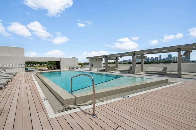 pool featuring a deck and a patio
