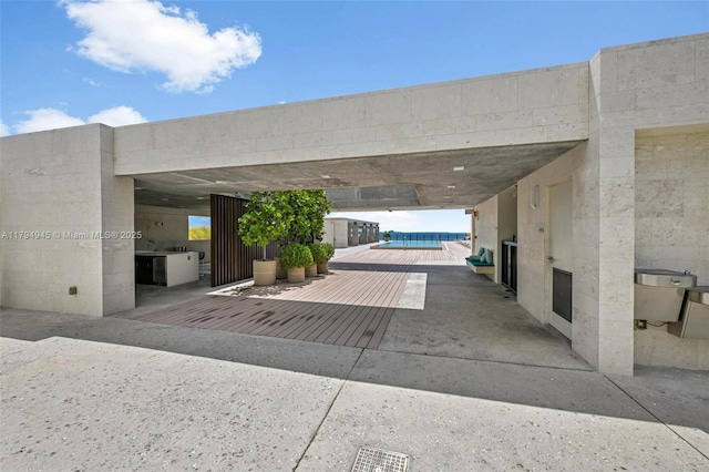 view of parking featuring visible vents