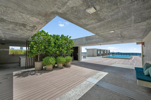 deck with a fenced in pool