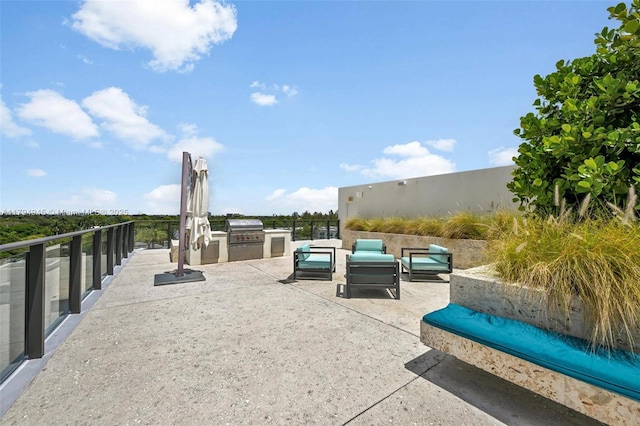 view of patio / terrace with outdoor lounge area, exterior kitchen, and area for grilling