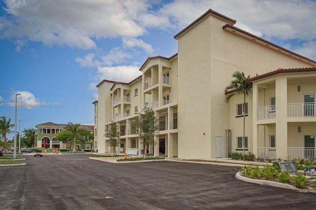 view of property featuring uncovered parking